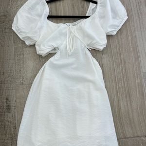 White Dress with open sides and open back puff sleeves Size S tiny dot stain